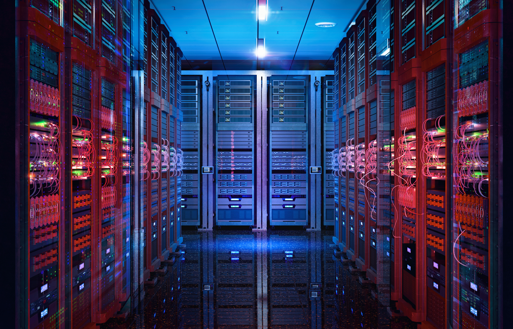 Data center server aisle lit in red and blue, racks and cabling receding into the distance